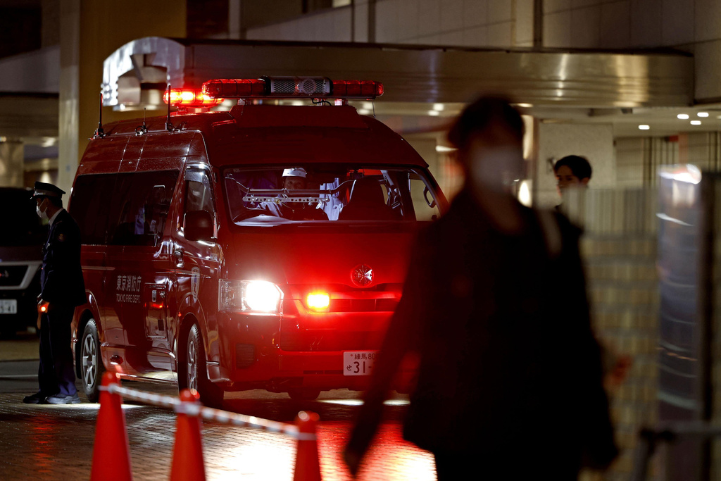 Police and emergency responders are on the scene of a deadly stabbing in downtown Tokyo on Thursday, March 26, 2026. (Kyodo News via AP)