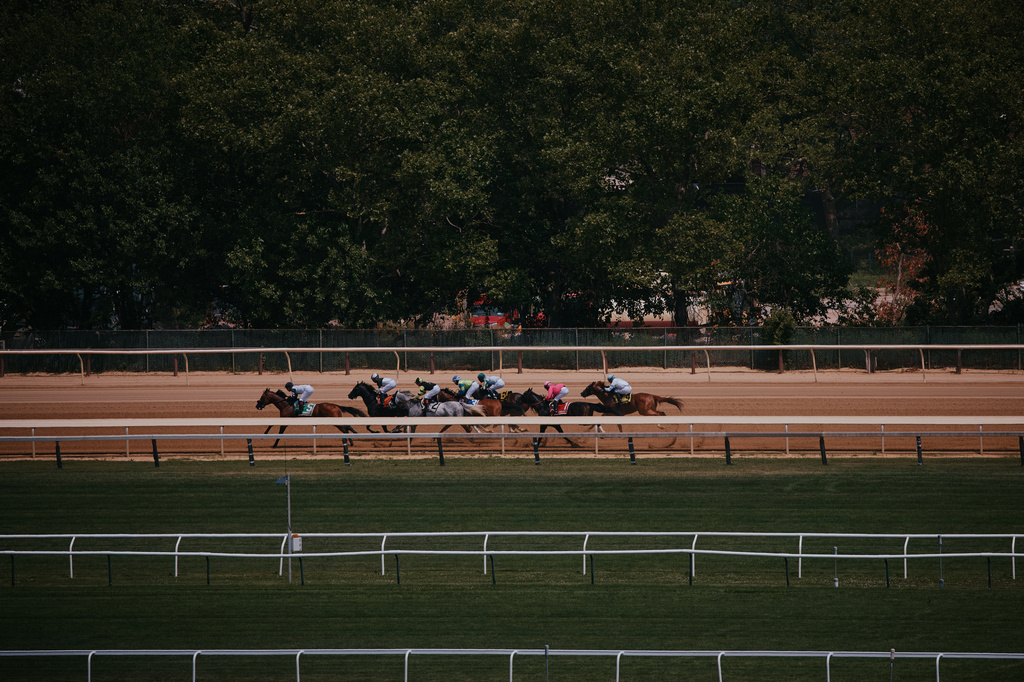 Horses race on closing day at Aqueduct Racetrack in the Queens borough of New York, Sunday, June 28, 2026. (AP Photo/Andres Kudacki)