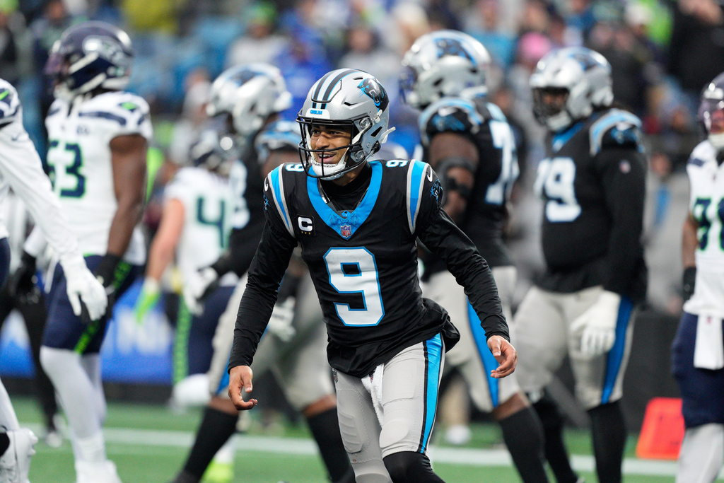 Carolina Panthers quarterback Bryce Young celebrates after scoring against the Seattle Seahawks during the second half of an NFL football game, Sunday, Dec. 28, 2025, in Charlotte, N.C. (AP Photo/Jacob Kupferman)