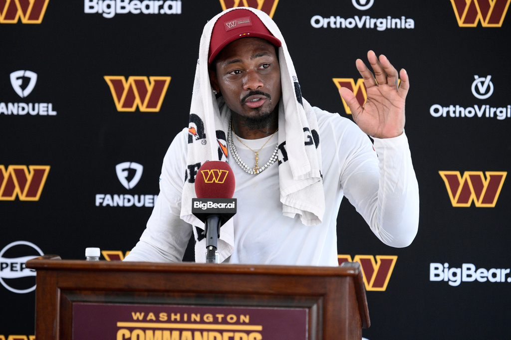 Washington Commanders wide receiver Stefon Diggs speaks to the media after practice at the team's NFL football training camp, Friday, Aug. 7, 2026 in Ashburn, Va. (AP Photo/Nick Wass)
