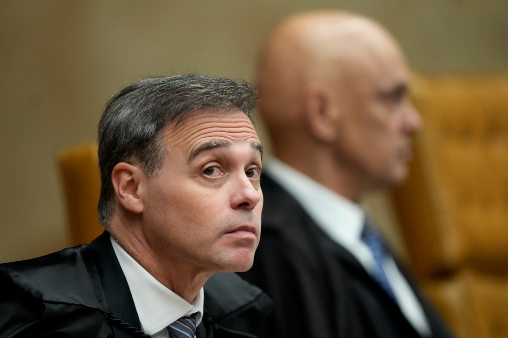 Supreme Court Justice Andre Mendonca, left, and Justice Alexandre de Moraes attend a plenary session of the court in Brasilia, Brazil, Wednesday, Sept. 2, 2026. (AP Photo/Eraldo Peres)