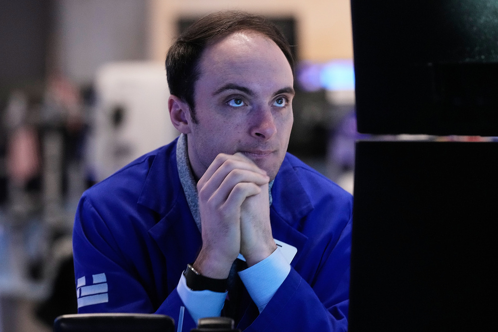 Specialist Joseph Maguire works at his post on the floor of the New York Stock Exchange, Tuesday, Feb. 3, 2026. (AP Photo/Richard Drew)