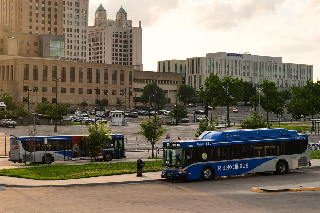 Buses wait for passengers at a transit center Friday, June 5, 2026, in Kansas City, Mo. (AP Photo/Charlie Riedel)