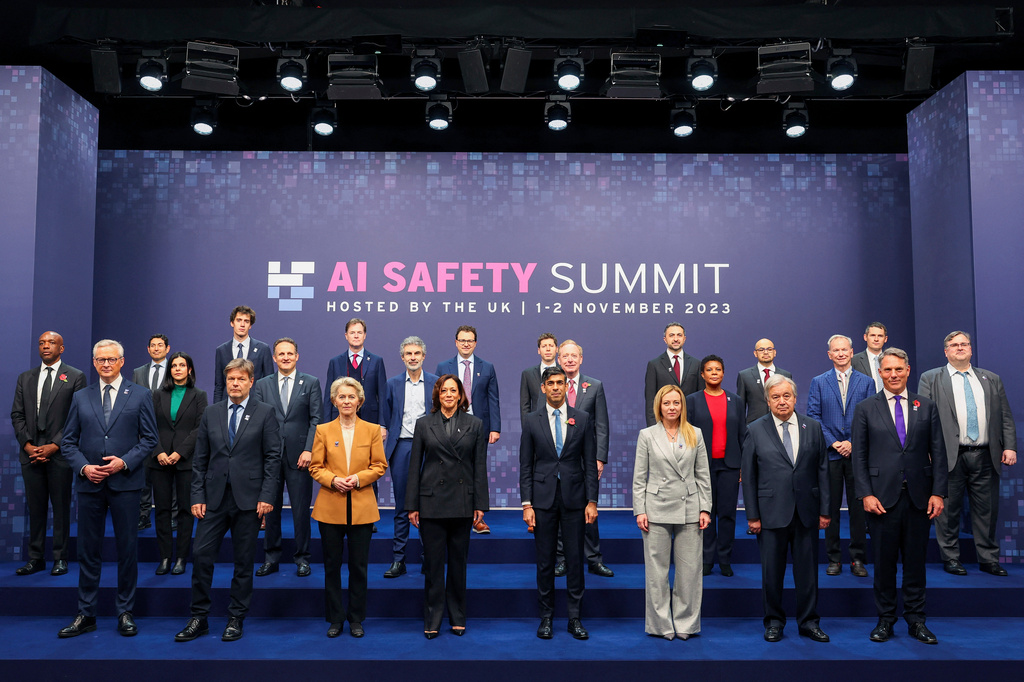 FILE - First row, from left, France's Minister for Economy, Finance, Industry and Digital Security Bruno Le Maire; German Economy and Climate Minister Robert Habeck, European Commission President Ursula von der Leyen, U.S. Vice President Kamala Harris, British Prime Minister Rishi Sunak, Italian Prime Minister Giorgia Meloni, U.N. Secretary General Antonio Guterres and Australian Deputy Prime Minister and Minister of Defense Richard Marles, middle and back row, from left, Google's James Manyika, President of the Carnegie Endowment for International Peace Tino Cuellar, AI Now Institute's Amba Kak, Mistral AI CEO Arthur Mensch, CEO of Amazon Web Services Adam Selipsky, Meta's Nick Clegg, Quebec AI Institute's Yoshua Bengio, Anthropic's Dario Amodei, OpenAI's Sam Altman, Microsoft's Brad Smith, Inflection AI Co-Founder Mustafa Suleyman, former acting director of the White House Office of Science and Technology Policy Alondra Nelson, Google DeepMind's Demis Hassabis, Schmidt Futures Founder Eric Schmidt, Chair of UK Frontier AI Taskforce Ian Hogarth and Inflection AI's Reid Hoffman pose for a group photo on the second day of the UK Artificial Intelligence Safety Summit at Bletchley Park, in Bletchley, England, on Nov. 2, 2023. (Toby Melville/Pool Photo via AP, File)