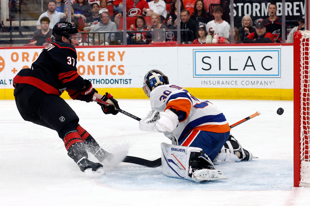 Carolina Hurricanes' Andrei Svechnikov (37) shoots the puck wide of New York Islanders goaltender Ilya Sorokin (30) during the second period of an NHL hockey game in Raleigh, N.C., Saturday, April 4, 2026. (AP Photo/Karl DeBlaker)