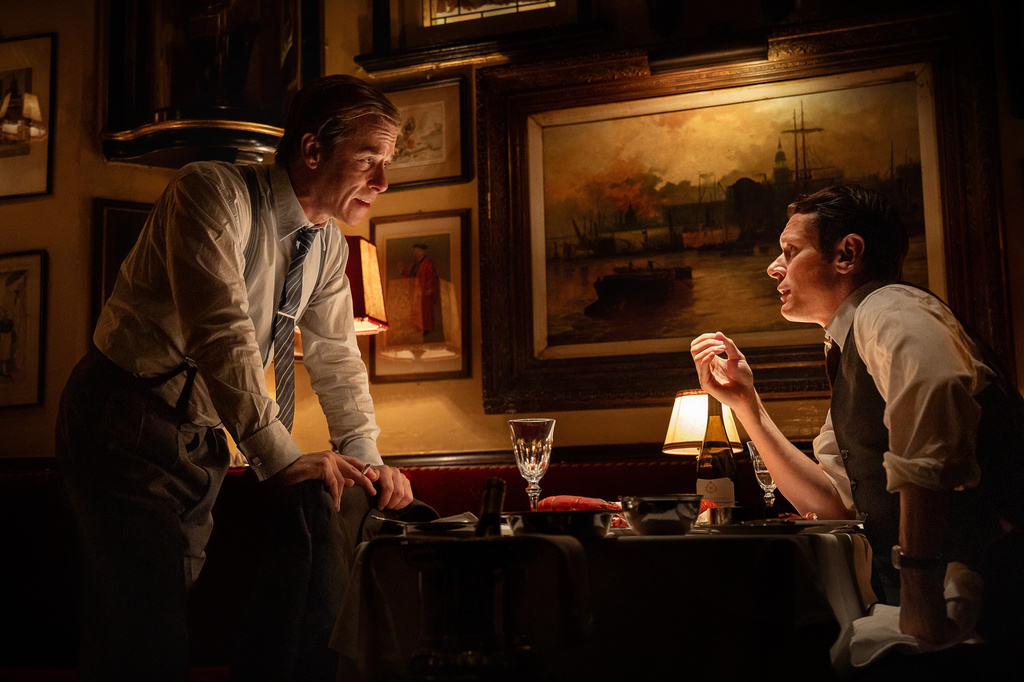 This image released by Netflix shows Guy Pearce as Rupert Murdoch, left, and Jack O'Connell as Larry Lamb, in a scene from "Ink."(Anthony Dickenson/Netflix via AP)
