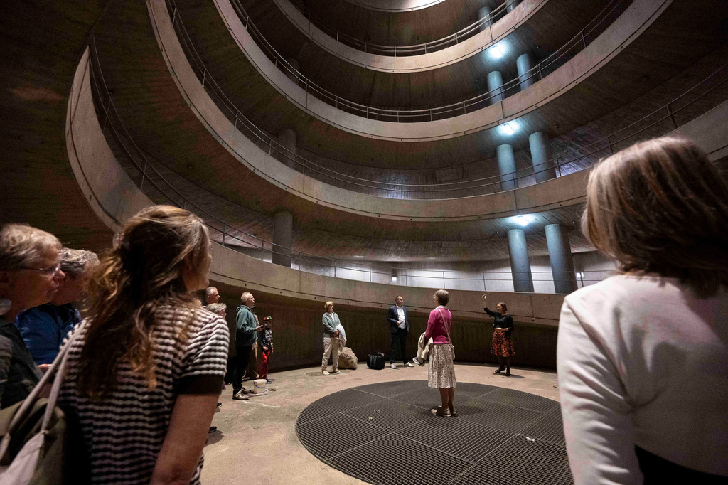 People yodel during a public event in an underground garage in Graz, Austria, on Wednesday, Sept. 23, 2026. (AP Photo/Denes Erdos)