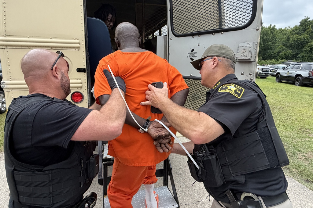 In this photo provided by the North Carolina State Bureau of Investigation, law enforcement officers load an inmate for transport Monday, June 29, 2026, at the Bertie-Martin Regional Detention Center Windsor, Bertie County, N.C. (North Carolina Bureau State Bureau of Investigation via AP)