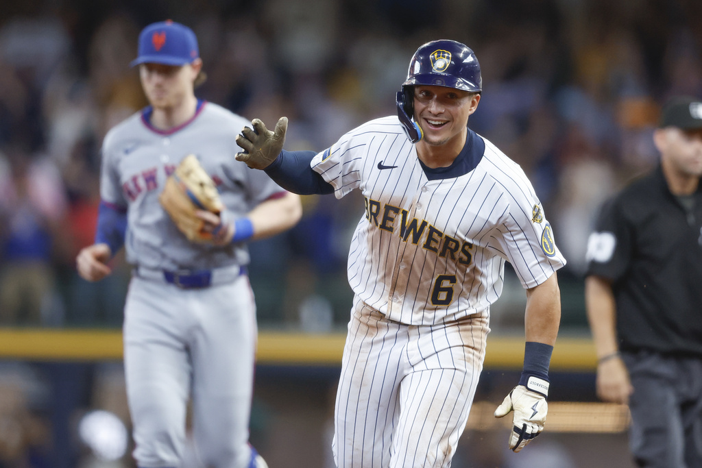 Milwaukee Brewers' Isaac Collins reacts after he hit a walk-off home run during the ninth inning of a baseball game against the New York Mets, Sunday, Aug.10, 2025, in Milwaukee. (AP Photo/Jeffrey Phelps)