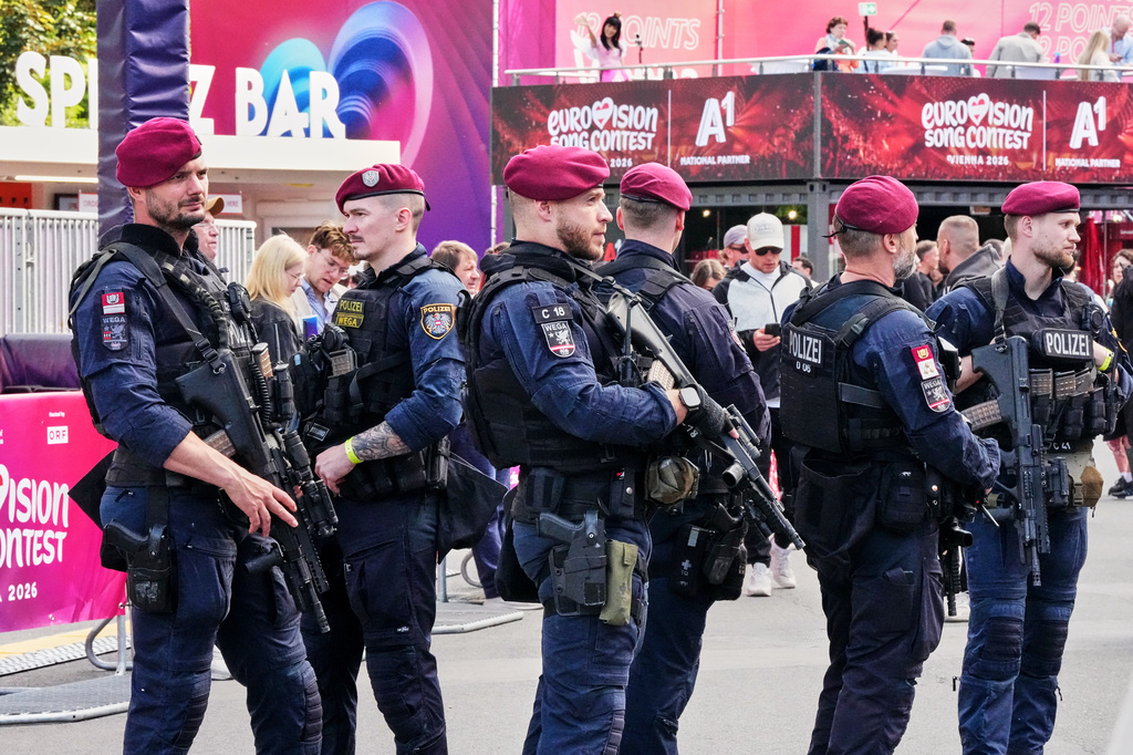 Police patrols with heavy weapons at the Eurovision Village during the 70th Eurovision Song Contest week in Vienna, Austria, Wednesday, May 13, 2026. (AP Photo/Martin Meissner)