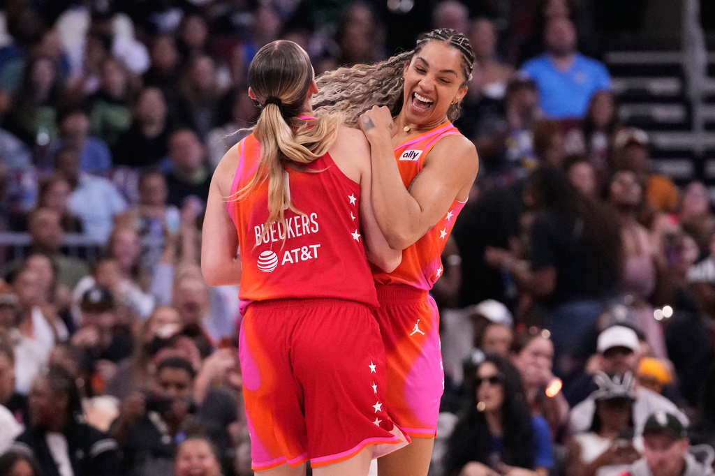 Team Coop's Gabby Williams, right, celebrates with Paige Bueckers after she scored a three-point basket during the first half of a WNBA All-Star basketball game against Team Spoon in Chicago, Saturday, July 25, 2026. (AP Photo/Nam Y. Huh)