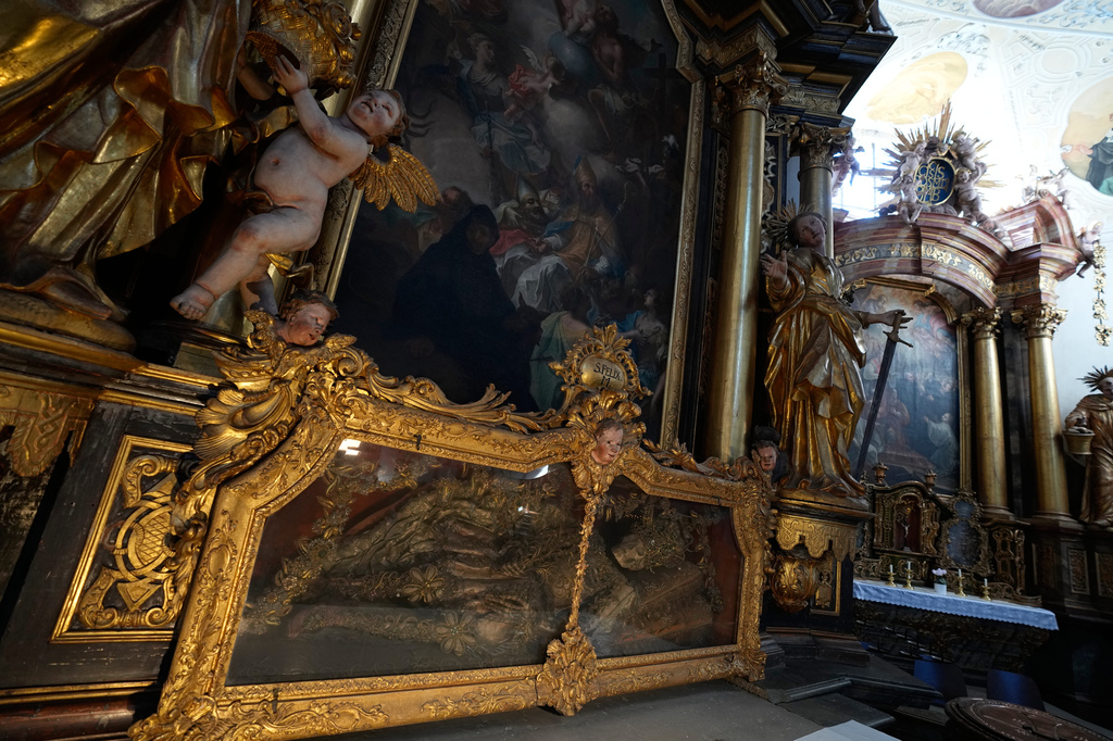 An elaborately decorated skeleton lies in the catholic monastery church of Banz in Bad Staffelstein, Germany, Saturday, May 2, 2026. (AP Photo/Matthias Schrader)