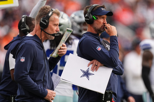 Dallas Cowboys head coach Brian Schottenheimer, right, and defensive coordinator Matt Eberflus, left, watch play against the Denver Broncos in the second half of an NFL football game Sunday, Oct. 26, 2025, in Denver. (AP Photo/David Zalubowski) Dallas Cowboys head coach Brian Schottenheimer, right, and defensive coordinator Matt Eberflus, left, watch play against the Denver Broncos in the second half of an NFL football game Sunday, Oct. 26, 2025, in Denver. (AP Photo/David Zalubowski)