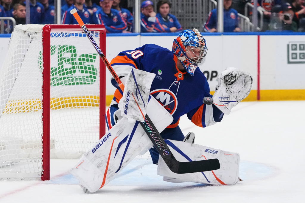 New York Islanders goaltender Ilya Sorokin (30) stops a shot during the second period of an NHL hockey game against the New Jersey Devils Tuesday, Jan. 6, 2026, in Elmont, N.Y. (AP Photo/Frank Franklin II)