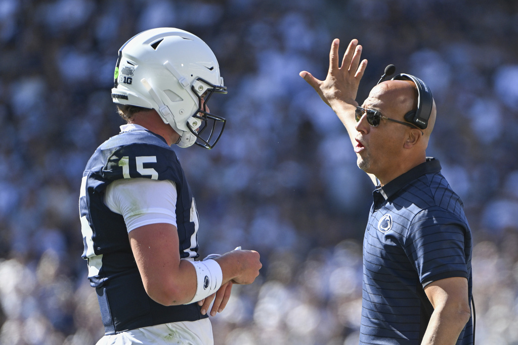 Penn State head coach James Franklin talks with quarterback Drew Allar (15) during the first quarter of an NCAA college football game against Nevada, Saturday, Aug. 30, 2025, in State College, Pa. (AP Photo/Barry Reeger)