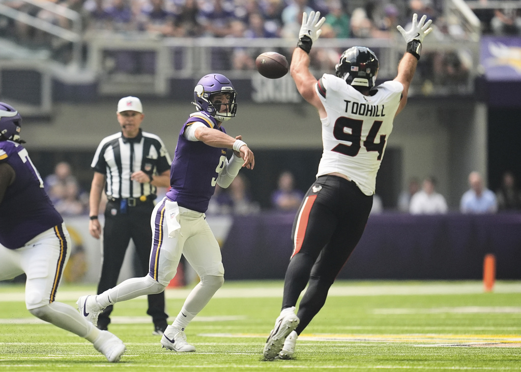 Houston Texans defensive end Casey Toohill (94) blocks a pass from Minnesota Vikings quarterback J.J. McCarthy during the first half of an NFL preseason football game, Saturday, Aug. 9, 2025, in Minneapolis. (AP Photo/Abbie Parr)