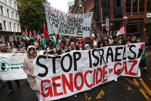 People take part in a demonstration organized by GM Friends of Palestine at Manchester Cathedral, in Manchester, England, Saturday, Oct. 4 2025. (Ryan Jenkinson/PA via AP) People take part in a demonstration organized by GM Friends of Palestine at Manchester Cathedral, in Manchester, England, Saturday, Oct. 4 2025. (Ryan Jenkinson/PA via AP)