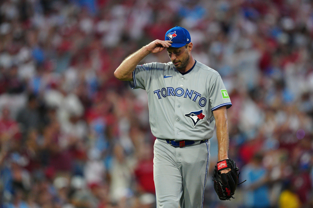 Toronto Blue Jays pitcher Max Scherzer reacts after giving up a solo home run to Philadelphia Phillies' Bryce Harper during the sixth inning of a baseball game, Saturday, Aug. 8, 2026, in Philadelphia. (AP Photo/Derik Hamilton)