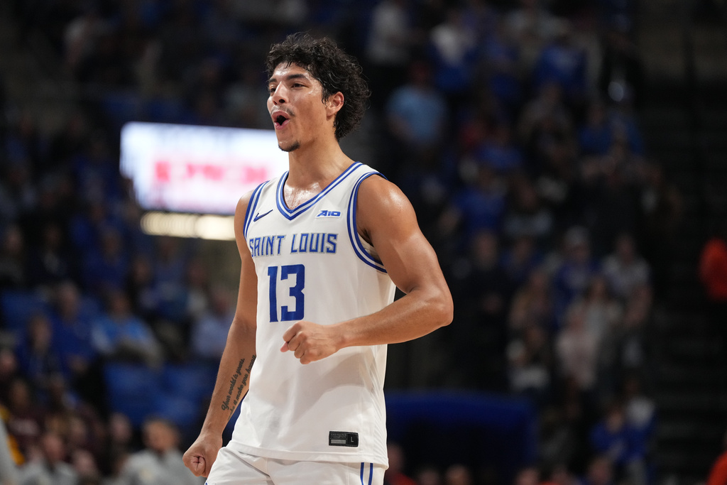 Saint Louis' Dion Brown (13) celebrates during the second half of an NCAA college basketball game against the Loyola Chicago Wednesday, March 4, 2026, in St. Louis. (AP Photo/Jeff Roberson)