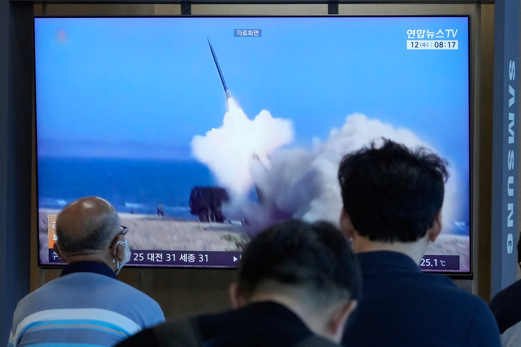 A TV screen shows a file image of North Korea's missile launch during a news program at Seoul Railway Station in Seoul, South Korea, Wednesday, Aug. 12, 2026. (AP Photo/Ahn Young-joon)