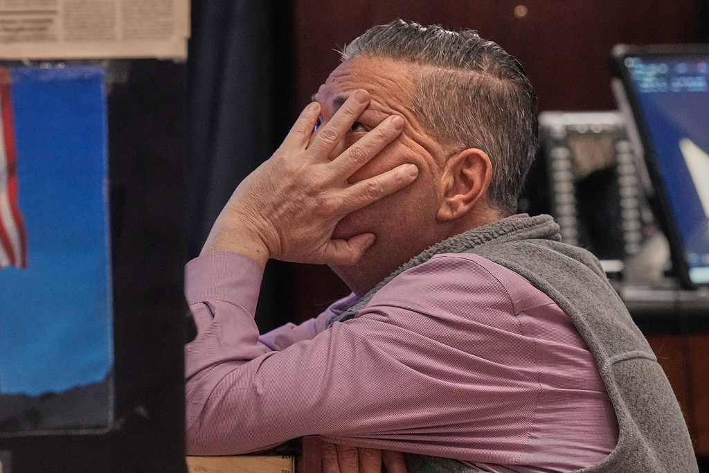 Trader Jonathan Mueller works on the floor of the New York Stock Exchange, Tuesday, Feb. 3, 2026. (AP Photo/Richard Drew)