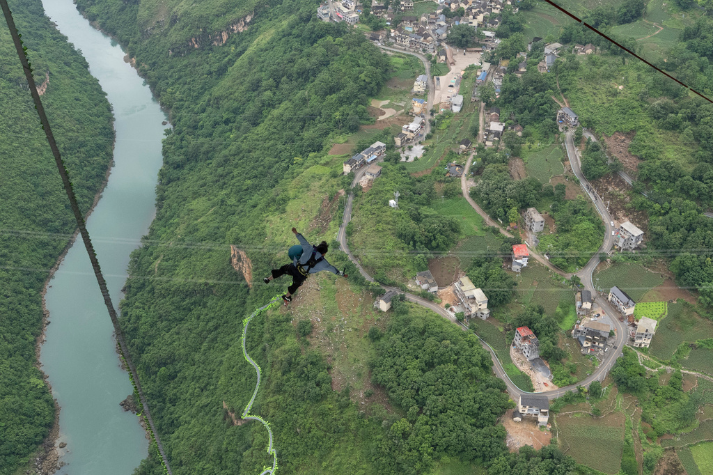 A tourist leaps for a bungee jump from the Huajiang Grand Canyon Bridge, considered to be the world’s highest bridge, in Anshun in southwestern China's Guizhou province on Friday, May 29, 2026. (AP Photo/Ng Han Guan)