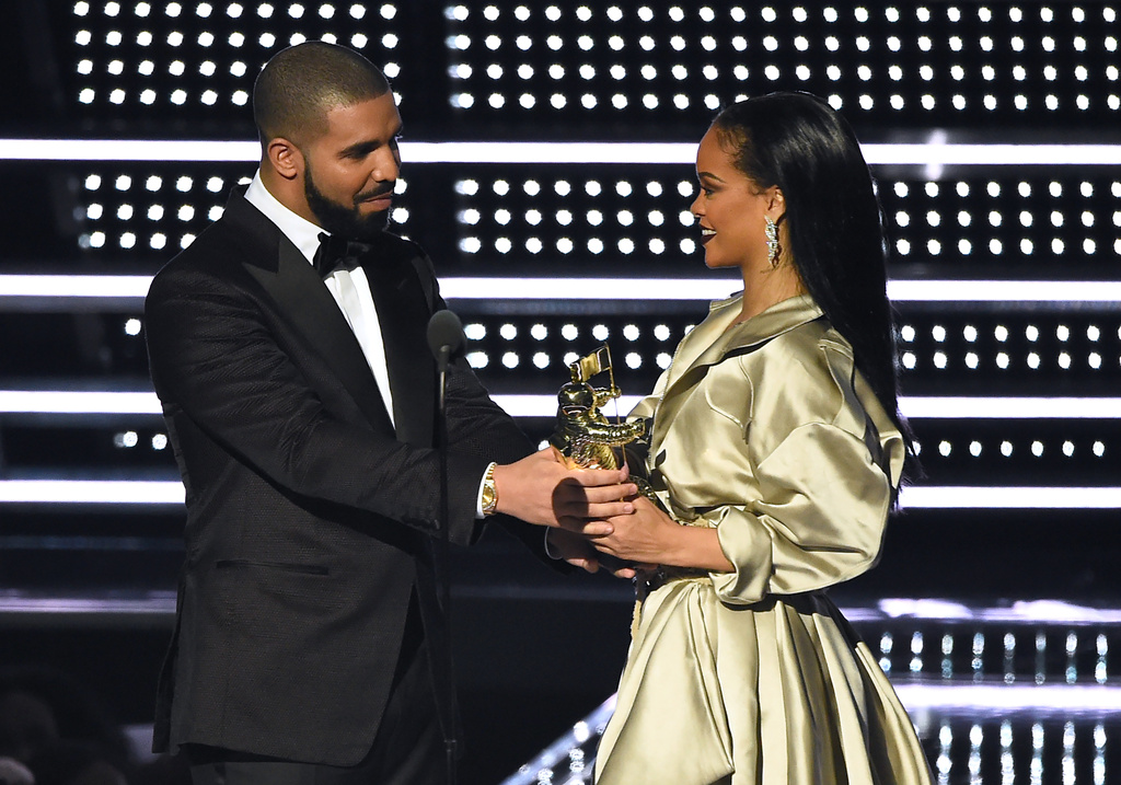 FILE - Drake, left, presents the Michael Jackson Video Vanguard Award to Rihanna at the MTV Video Music Awards at Madison Square Garden in New York, Aug. 28, 2016. (Photo by Charles Sykes/Invision/AP, File)