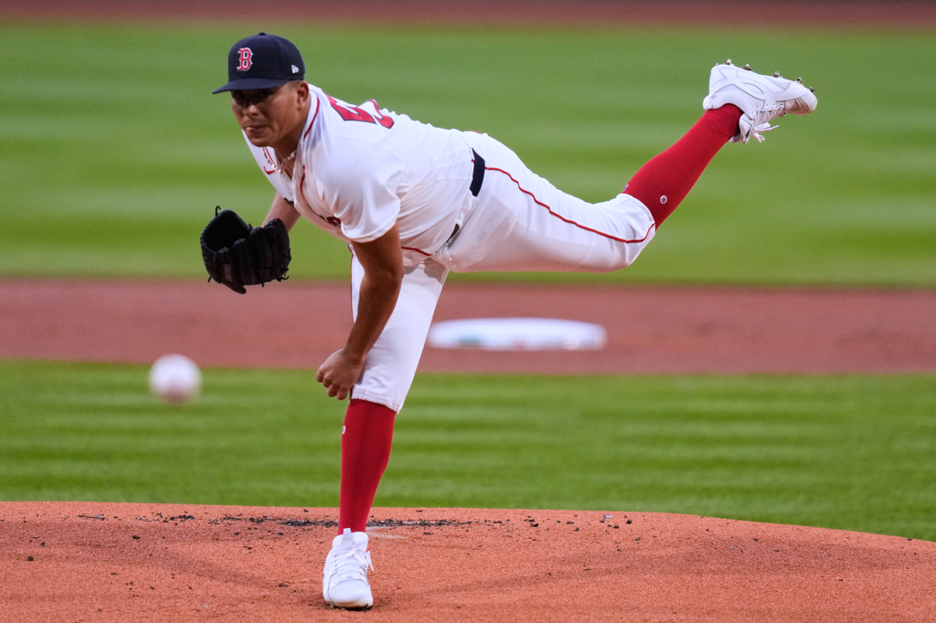 Boston Red Sox pitcher Ranger Suarez delivers during the first inning of a baseball game against the New York Yankees at Fenway Park, Wednesday, April 22, 2026, in Boston. (AP Photo/Charles Krupa)
