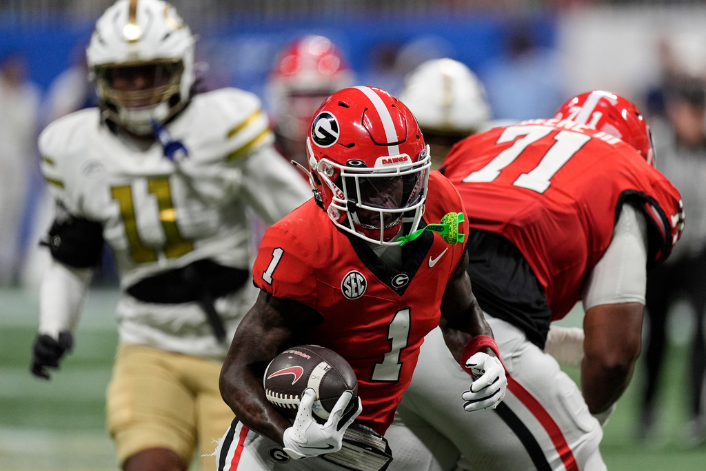 Georgia wide receiver Zachariah Branch (1) runs against Georgia Tech during the first half of an NCAA college football game, Friday, Nov. 28, 2025, in Atlanta. (AP Photo/Mike Stewart)
