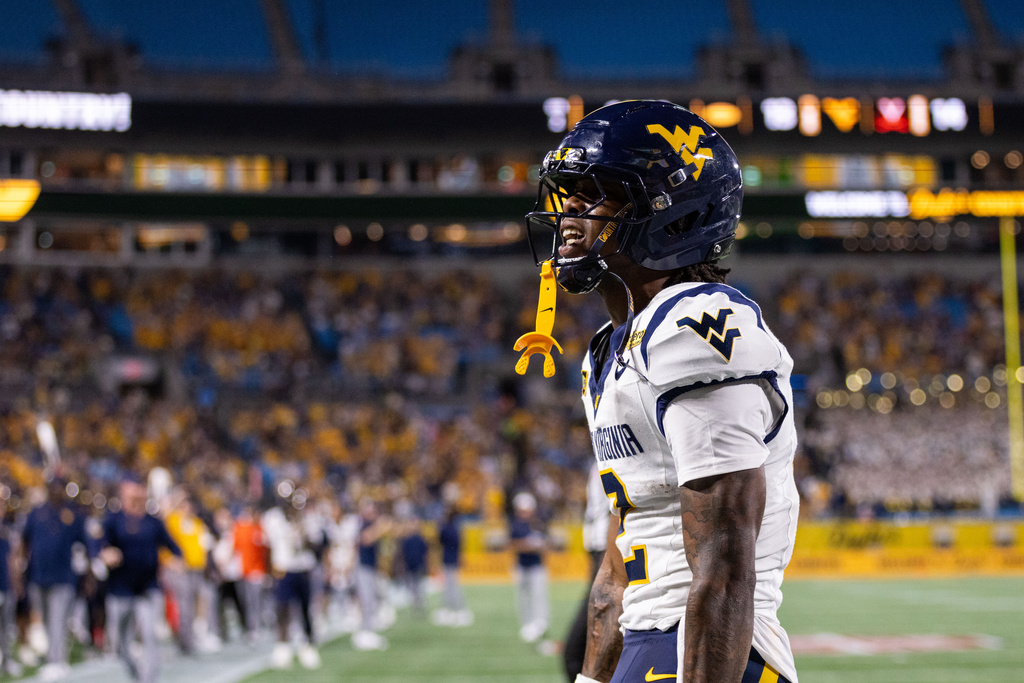 West Virginia wide receiver DJ Epps celebrates after a touchdown against Virginia in an NCAA college football game Saturday, Sept. 19, 2026, in Charlotte, N.C. (AP Photo/Scott Kinser)