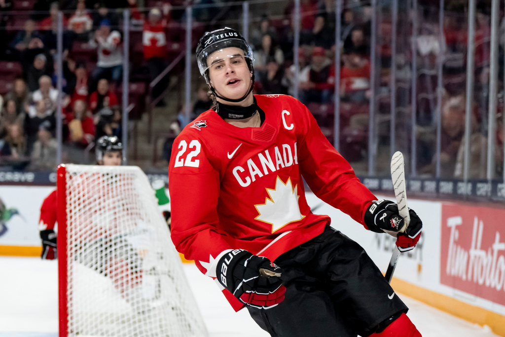 Canada's Porter Martone (22) celebrates after scoring during second-period IIHF World Junior Hockey Championship quarterfinals game action against Slovakia in Minneapolis, Friday, Jan. 2, 2026. (Christopher Katsarov/The Canadian Press via AP)