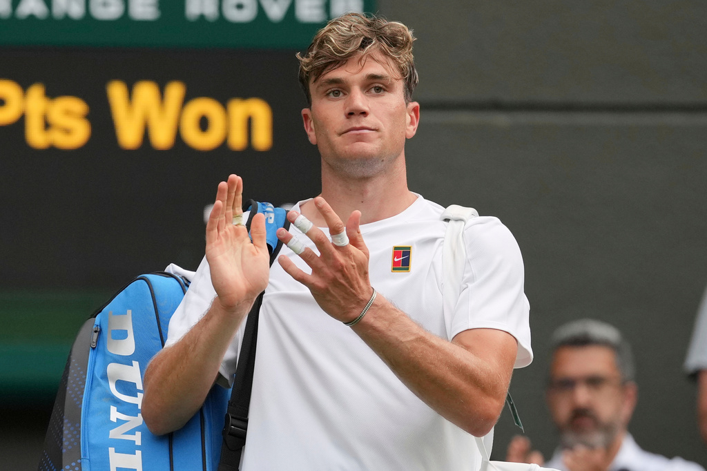 FILE - Jack Draper, of Britain, reacts after losing his second round men's singles match against Marin Cilic of Croatia at the Wimbledon Tennis Championships in London, Thursday, July 3, 2025.(AP Photo/Kin Cheung, File)