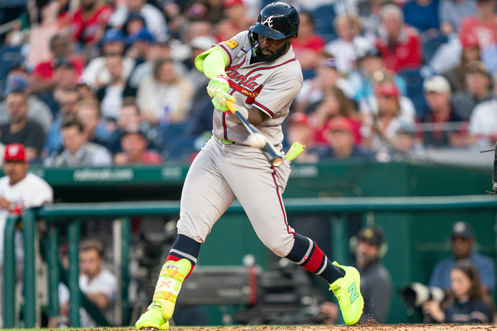Atlanta Braves Michael Harris II hits a home run in the third inning during a baseball game against the Washington Nationals, Wednesday, April 22, 2026, in Washington. (AP Photo/Nathan Howard)