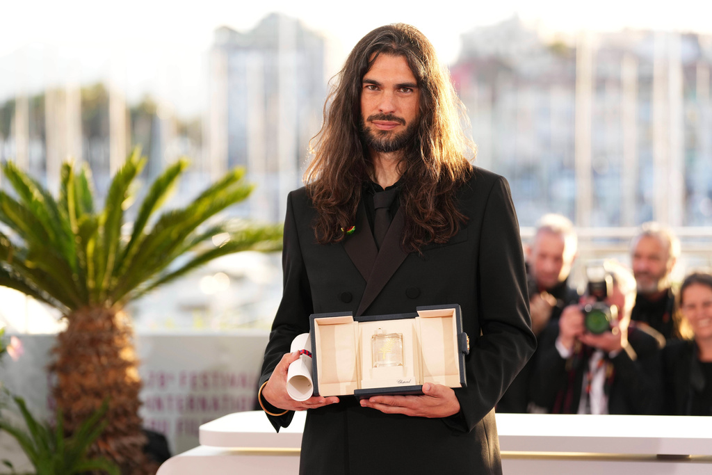 FILE - Director Oliver Laxe, winner of the jury prize for the film "Sirat", appears at the awards ceremony photocall at the 78th international film festival, Cannes, southern France, on May 24, 2025. (Photo by Scott A Garfitt/Invision/AP, File)