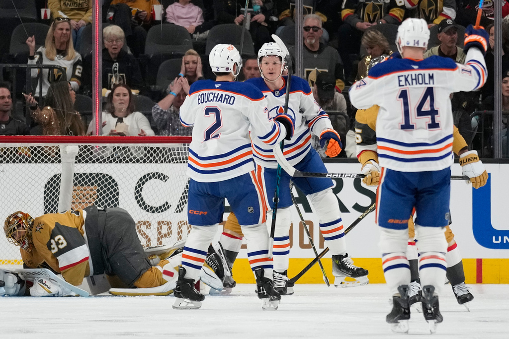 Edmonton Oilers center Trent Frederic, center, celebrates after scoring against the Vegas Golden Knights during the second period of an NHL hockey game Sunday, March 8, 2026, in Las Vegas. (AP Photo/John Locher)
