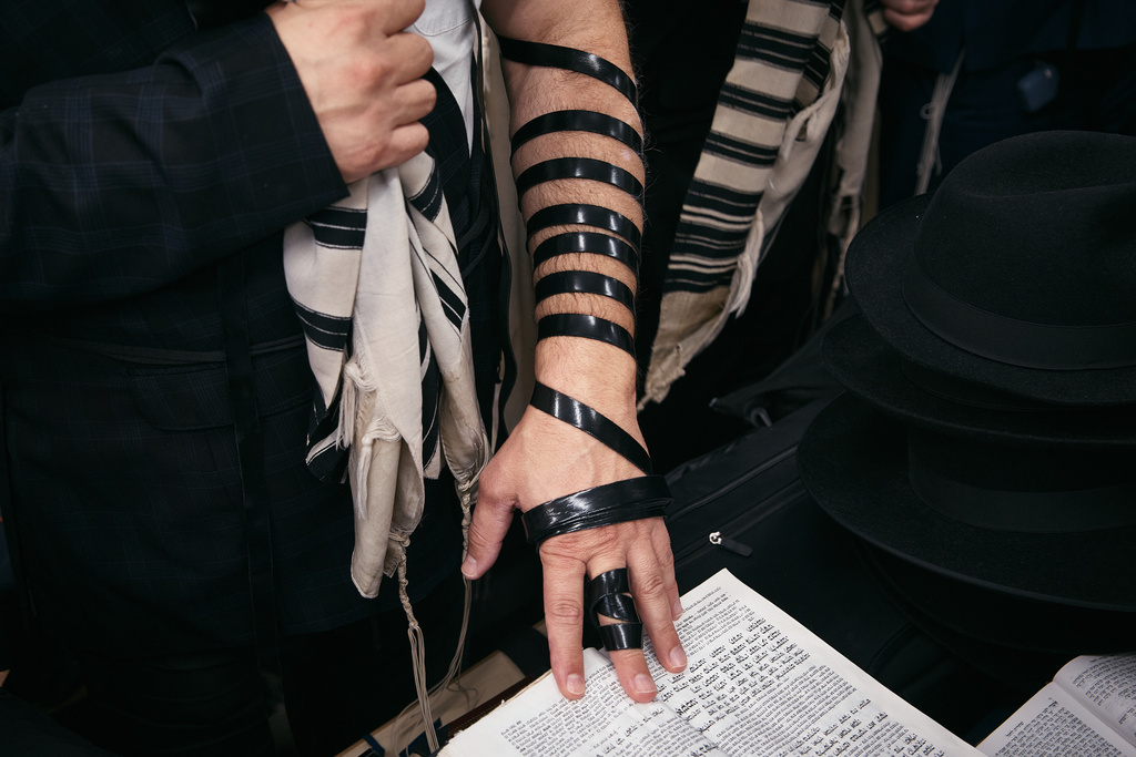 A Chabad-Lubavitch rabbi prays at the resting place of the Rebbe, Rabbi Menachem M. Schneerson, one of Judaism’s most influential figures, in the Queens borough of New York on Friday, Nov. 14, 2025, during the International Conference of Chabad-Lubavitch Emissaries. (AP Photo/Andres Kudacki)