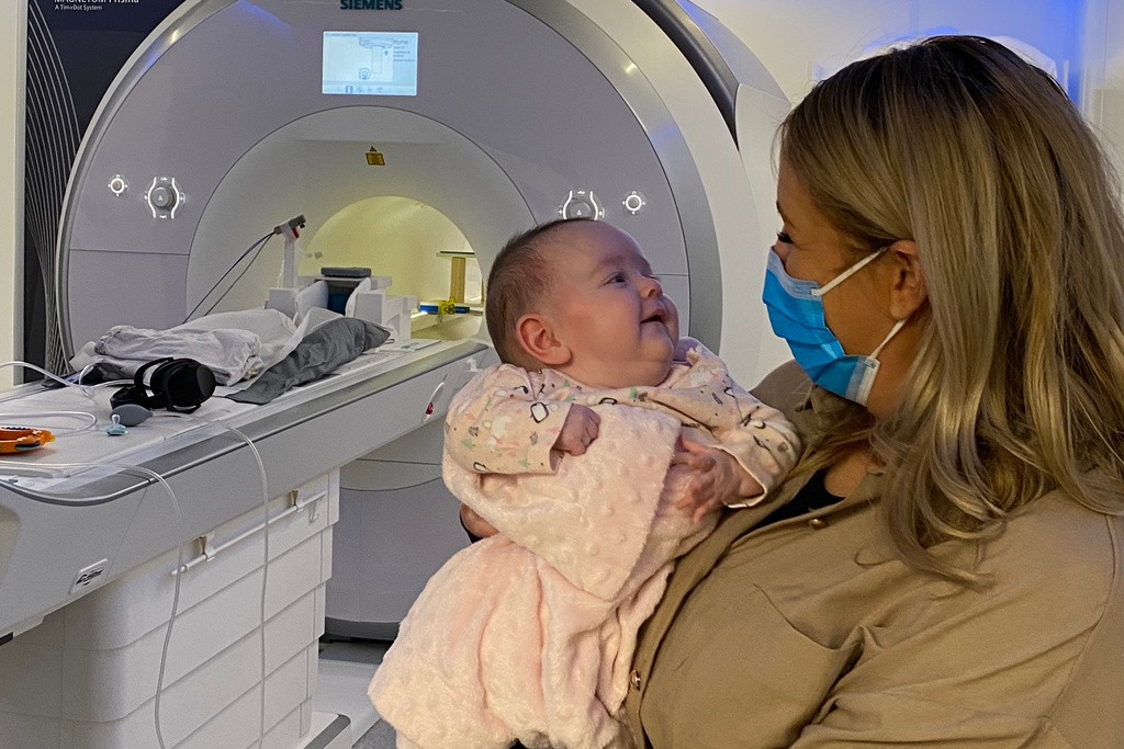In this undated photo, baby Sadie attends her 2-month Foundcog scan with her mother Donna at Trinity College Institute of Neuroscience in Dublin, Ireland. (Cusack Lab via AP)