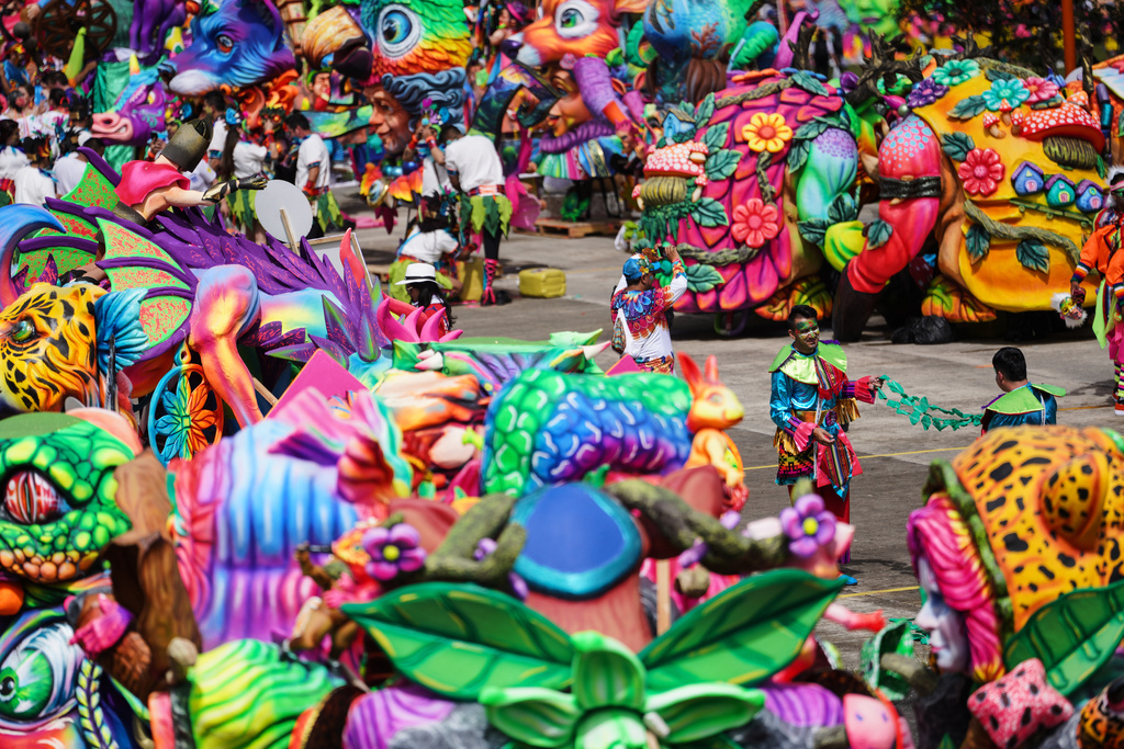 Revelers get ready for the start of the Black and White Carnival, recognized by UNESCO as Intangible Cultural Heritage, in Pasto, Colombia, Tuesday, Jan. 6, 2026. (AP Photo/Ivan Valencia)