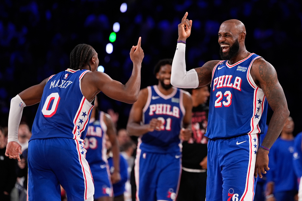 tPhiladelphia 76ers' LeBron James (23) and Tyrese Maxey (0) celebrate during the second half of an NBA basketball game against the Cleveland Cavaliers Thursday, Oct. 22, 2026, in Philadelphia. (AP Photo/Matt Slocum)