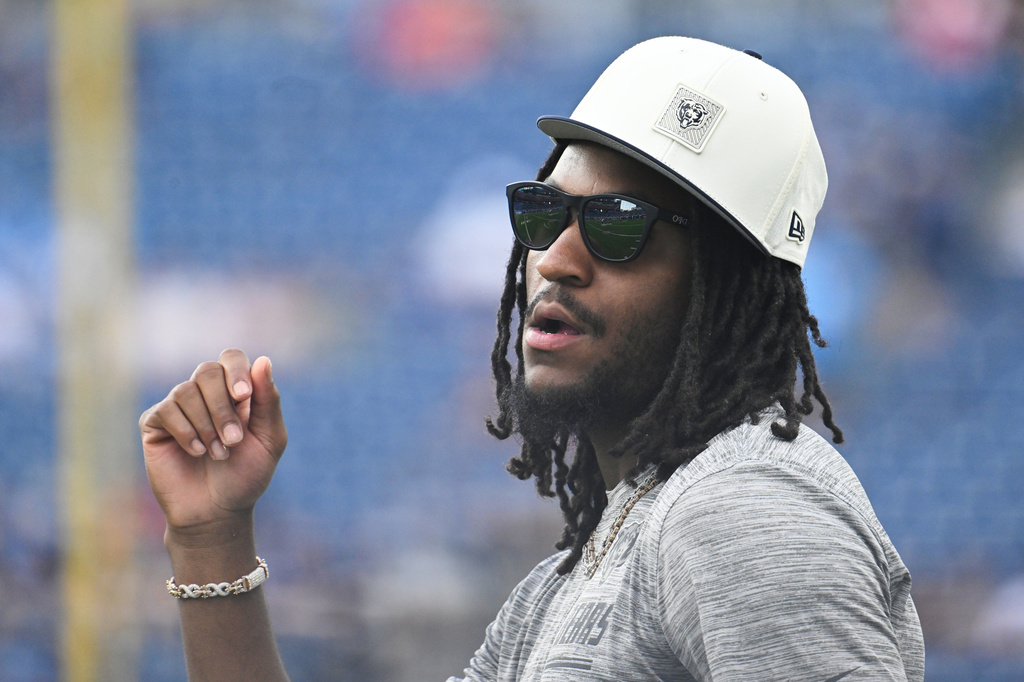 Chicago Bears wide receiver Luther Burden III looks on as teammates warm up prior to a preseason NFL football game against the Tennessee Titans, Saturday, Aug. 29, 2026, in Nashville, Tenn. (AP Photo/John Amis)