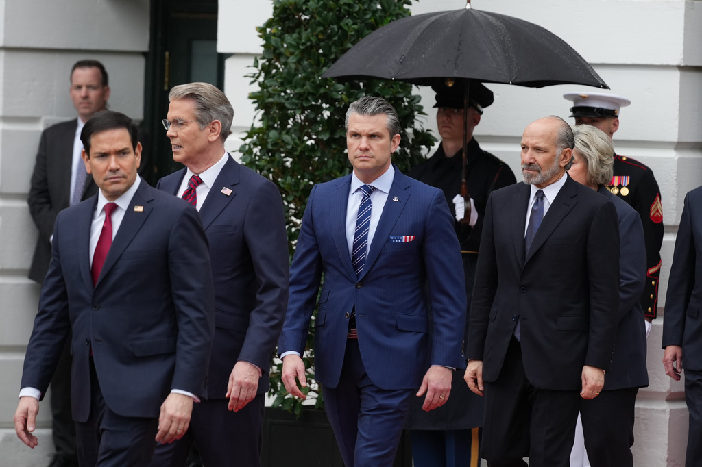 From left, Secretary of State, Marco Rubio, Treasury Secretary Scott Bessent, Secretary of Defense Pete Hegseth and Commerce Secretary Howard Lutnick, arrive before President Donald Trump and first lady Melania Trump greet Britain's King Charles III and Queen Camilla during a State Visit arrival ceremony on the South Lawn of the White House, Tuesday, April 28, 2026, in Washington. (AP Photo/Mark Schiefelbein)
