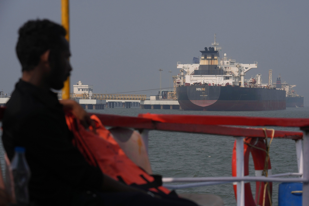 Liberia-flagged tanker Shenlong Suezmax, carrying crude oil from Saudi Arabia, that arrived clearing the Strait of Hormuz, is seen at the Mumbai Port in Mumbai, India, Thursday, March 12, 2026. (AP Photo/Rafiq Maqbool)