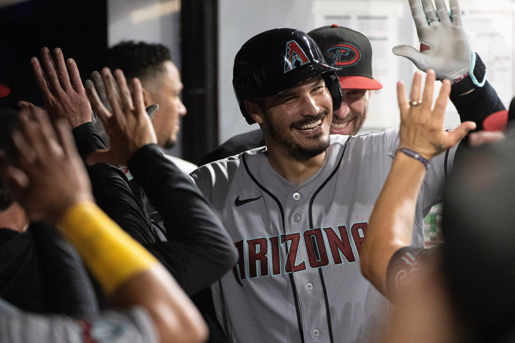 Arizona Diamondbacks' Nolan Arenado celebrates after hitting a solo home run off Cleveland Guardians relief pitcher Hunter Gaddis during the eighth inning of a baseball game, Saturday, Aug. 1, 2026, in Cleveland. (AP Photo/Phil Long)