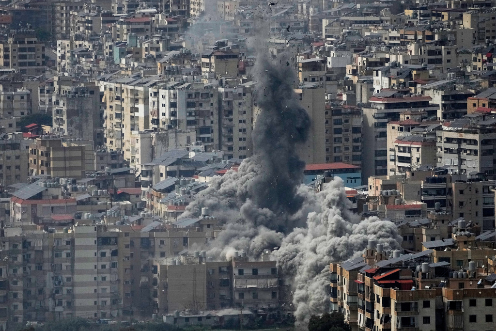 Smoke rises following an Israeli airstrike in Dahiyeh, Beirut's southern suburbs, Friday, March 6, 2026. (AP Photo/Hussein Malla)