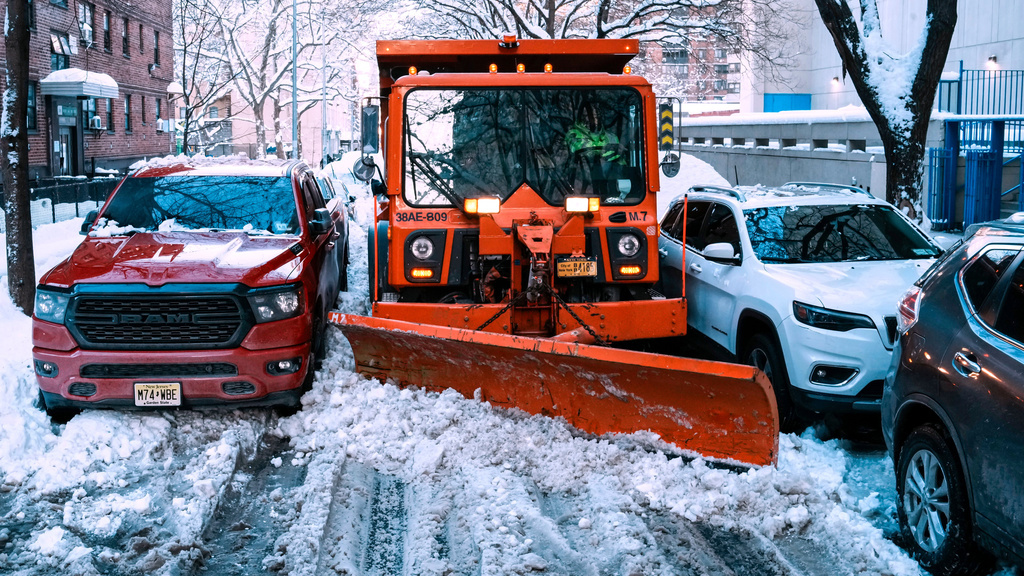 A truck removes snow for them street a day after a winter storm on Tuesday, Feb. 24, 2026, in New York. (AP Photo/Eduardo Munoz Alvarez)