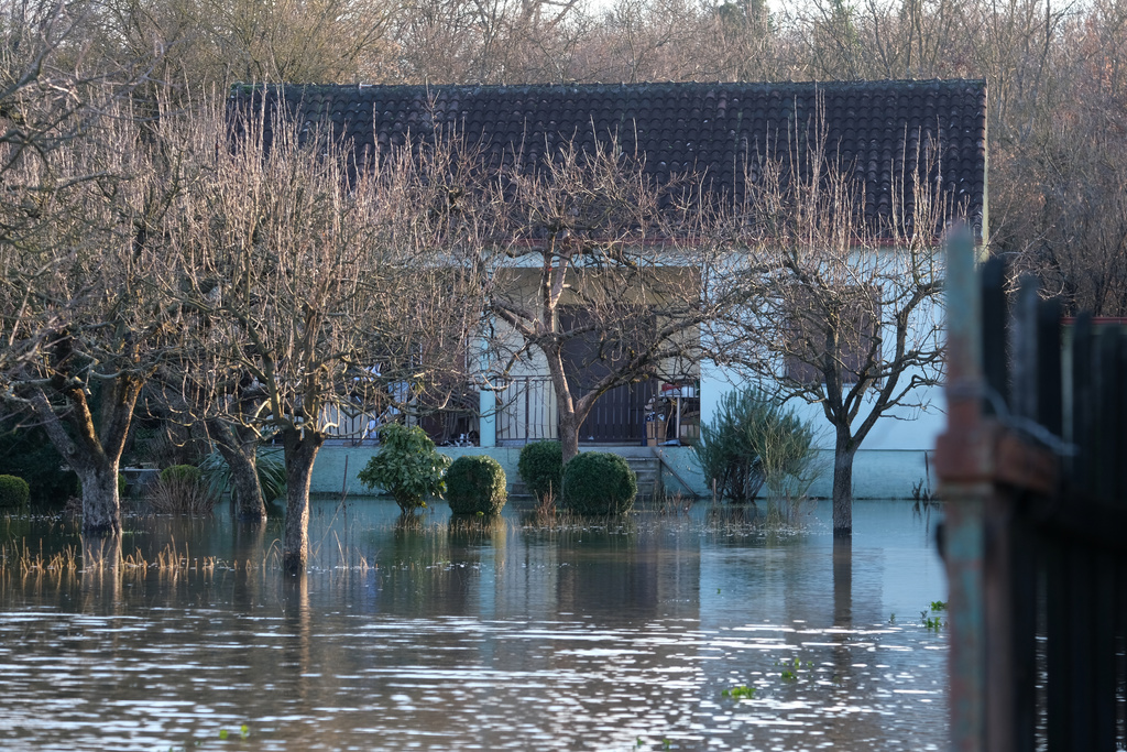A house in the village of Klikovace, in Montenegro, after heavy rainfall this week, Thursday, Jan. 8, 2026. (AP Photo/Risto Bozovic)
