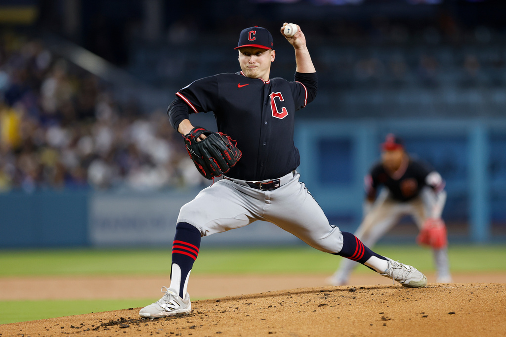 Cleveland Guardians starting pitcher Parker Messick (77) releases a pitch during the first inning of a baseball game against the Los Angeles Dodgers, Monday, March 30, 2026, in Los Angeles. (AP Photo/Caroline Brehman)