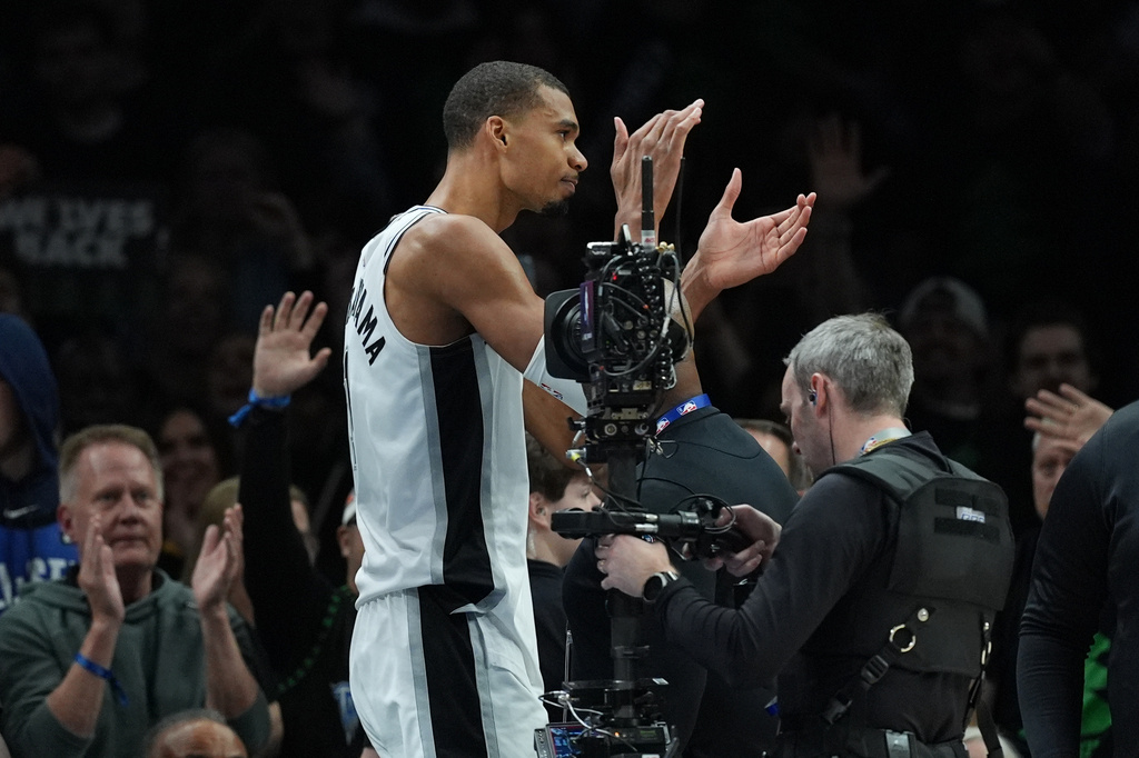 San Antonio Spurs forward Victor Wembanyama (1) reacts after he was ejected for a flagrant foul during the first half of Game 4 of an NBA basketball second-round playoffs series against the Minnesota Timberwolves in Minneapolis, Sunday, May 10, 2026. (AP Photo/Abbie Parr)