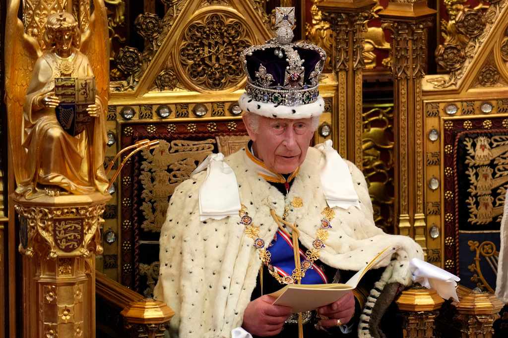 FILE - King Charles III looks up as he reads the King's Speech, during the State Opening of Parliament in the House of Lords in London on July 17, 2024. (AP Photo/Kirsty Wigglesworth, Pool, File)