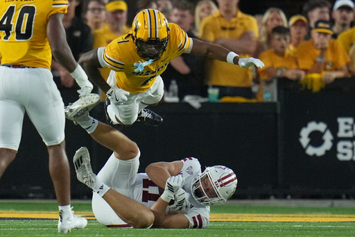 Massachusetts tight end Max Dowling (11) catches a pass as Missouri safety Marvin Burks Jr., top, defends during the first half of an NCAA college football game Saturday, Sept. 27, 2025, in Columbia, Mo. (AP Photo/Jeff Roberson) Massachusetts tight end Max Dowling (11) catches a pass as Missouri safety Marvin Burks Jr., top, defends during the first half of an NCAA college football game Saturday, Sept. 27, 2025, in Columbia, Mo. (AP Photo/Jeff Roberson)